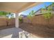 Relaxing backyard with a covered patio, gravel landscaping, and privacy fencing for outdoor enjoyment at 21120 E Creekside Dr, Queen Creek, AZ 85142