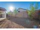 Backyard featuring desert landscaping, a covered patio, and privacy fencing for a serene outdoor setting at 21120 E Creekside Dr, Queen Creek, AZ 85142