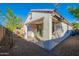 The backyard features a covered patio and desert landscaping for a private and relaxing outdoor experience at 21120 E Creekside Dr, Queen Creek, AZ 85142