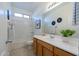 Bright bathroom featuring a bath tub and shower combination, and wood vanity at 21120 E Creekside Dr, Queen Creek, AZ 85142