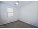 Bedroom featuring carpet, a ceiling fan, one window with blinds, and neutral paint at 21120 E Creekside Dr, Queen Creek, AZ 85142