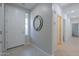 Bright foyer with tile flooring, a stylish mirror, and views into adjoining rooms at 21120 E Creekside Dr, Queen Creek, AZ 85142