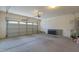 Spacious two-car garage featuring an automatic door, with room for storage and parking at 21120 E Creekside Dr, Queen Creek, AZ 85142