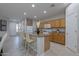 Kitchen with island seating, stainless steel appliances, and ample cabinet space, great for gatherings at 21120 E Creekside Dr, Queen Creek, AZ 85142