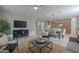 Bright, open living area with tile floors, a ceiling fan and a smooth transition to the dining area and kitchen at 21120 E Creekside Dr, Queen Creek, AZ 85142