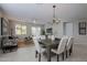 Inviting dining and living area with stylish furnishings, creating a comfortable and modern atmosphere at 21120 E Creekside Dr, Queen Creek, AZ 85142