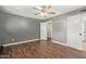 Neutral bedroom featuring wood flooring, closet space, and great natural light at 2161 E Harmony Cir, Mesa, AZ 85204