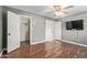 Neutral bedroom with wood flooring, closet, and ample natural light at 2161 E Harmony Cir, Mesa, AZ 85204