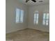 Bright bedroom featuring shuttered windows and neutral tones, creating a serene atmosphere at 22903 N 39Th Ter, Phoenix, AZ 85050