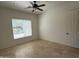 Well-lit bedroom with tile floor and a ceiling fan providing comfortable living space at 22903 N 39Th Ter, Phoenix, AZ 85050