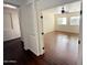 Sun-filled bedroom with hardwood floors, a ceiling fan, and views of the neighborhood through large windows at 22903 N 39Th Ter, Phoenix, AZ 85050