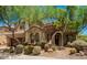 Charming single Gathering home with beautiful desert landscaping, mature trees, and a tile roof in a sunny setting at 22903 N 39Th Ter, Phoenix, AZ 85050