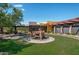 Contemporary exterior design with drought resistant front yard landscaping and pergola at 22903 N 39Th Ter, Phoenix, AZ 85050