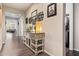 Inviting hallway featuring wood-look flooring and decorative accents at 22920 E Indiana Ave, Queen Creek, AZ 85142