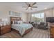 Tranquil main bedroom with neutral colors, a king-sized bed, and ample natural light at 22920 E Indiana Ave, Queen Creek, AZ 85142