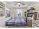 Home office converted to a bedroom, featuring built-in storage and a hideaway murphy bed, for flexible living at 22920 E Indiana Ave, Queen Creek, AZ 85142