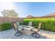 Outdoor patio area with fire pit and comfortable seating, perfect for entertaining at 22920 E Indiana Ave, Queen Creek, AZ 85142