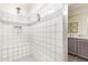 Tiled shower with built-in bench and decorative tile accents at 22920 E Indiana Ave, Queen Creek, AZ 85142