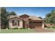 Charming single-story home with a desert landscape, tile roof, and inviting curb appeal at 23089 E Saddle Way, Queen Creek, AZ 85142
