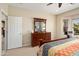 Bright bedroom featuring a cozy bed and ample natural light from the bay window at 26247 W Lone Cactus Dr, Buckeye, AZ 85396