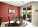 Cozy dining area with a glass table and access to an outdoor patio at 26247 W Lone Cactus Dr, Buckeye, AZ 85396