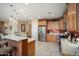 Spacious kitchen with bar seating, stainless steel appliances, and lots of counter space at 26247 W Lone Cactus Dr, Buckeye, AZ 85396