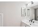 Clean bathroom with white vanity, framed mirror, and modern fixtures at 2815 N 52Nd St # 3, Phoenix, AZ 85008