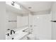 Bathroom with a white vanity, black fixtures, and a shower-tub combo at 2815 N 52Nd St # 3, Phoenix, AZ 85008