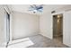 Bedroom featuring a ceiling fan, natural light, and door to hallway at 2815 N 52Nd St # 3, Phoenix, AZ 85008