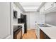 Efficient kitchen featuring white cabinets, black appliances, and ample countertop space at 2815 N 52Nd St # 3, Phoenix, AZ 85008