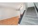 Spacious living room with a fireplace, stairs, and wood-look flooring at 2815 N 52Nd St # 3, Phoenix, AZ 85008