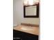 Bathroom boasts an elegant dark vanity, granite countertop, and modern lighting fixture at 30 E Brown Rd # 2113, Mesa, AZ 85201