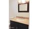 Bathroom boasts an elegant dark vanity, granite countertop, and modern lighting fixture at 30 E Brown Rd # 2113, Mesa, AZ 85201