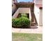 Condo exterior featuring a tidy garden, neutral colors, and easy access stairs at 30 E Brown Rd # 2113, Mesa, AZ 85201