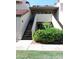 Condo exterior featuring a tidy garden, neutral colors, and easy access stairs at 30 E Brown Rd # 2113, Mesa, AZ 85201