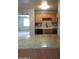 The kitchen features an island with granite countertops, wooden cabinets, and black appliances at 30 E Brown Rd # 2113, Mesa, AZ 85201