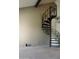 Living room featuring spiral staircase and neutral carpet at 30 E Brown Rd # 2113, Mesa, AZ 85201