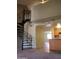A living room featuring an open design with spiral staircase and neutral carpet at 30 E Brown Rd # 2113, Mesa, AZ 85201