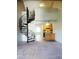 A living room featuring an open design with spiral staircase and neutral carpet at 30 E Brown Rd # 2113, Mesa, AZ 85201