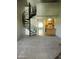 A living room featuring an open design with spiral staircase and neutral carpet at 30 E Brown Rd # 2113, Mesa, AZ 85201