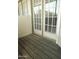 Spacious deck patio with plank flooring is framed by large, multi-pane glass doors at 30 E Brown Rd # 2113, Mesa, AZ 85201