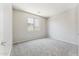 Bedroom featuring neutral walls, carpet, ceiling fan, and a window at 3310 W Chambers St, Phoenix, AZ 85041