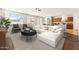 Bright, open-concept living room featuring a sectional sofa, and views to the eat-in kitchen at 3310 W Chambers St, Phoenix, AZ 85041
