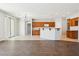 Spacious living area combines tile and hardwood flooring with views of the kitchen and dining spaces at 3310 W Chambers St, Phoenix, AZ 85041