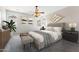 Comfortable main bedroom with neutral colors, soft textures, and stylish decor at 3310 W Chambers St, Phoenix, AZ 85041