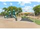 Community playground featuring a slide, climbing structures and covered picnic area for Gathering fun at 3310 W Chambers St, Phoenix, AZ 85041