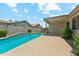 Backyard pool with patio, landscaping, and privacy wall at 3310 W Chambers St, Phoenix, AZ 85041