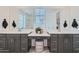 Elegant bathroom with double sinks, quartz countertops, and a makeup vanity at 3340 S Lotus Ave, Mesa, AZ 85212