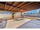 Spacious covered back patio with a table and chairs, perfect for outdoor living at 3410 E Everett Dr, Phoenix, AZ 85032