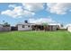 Expansive backyard featuring a covered patio, perfect for relaxation and outdoor activities at 3410 E Everett Dr, Phoenix, AZ 85032